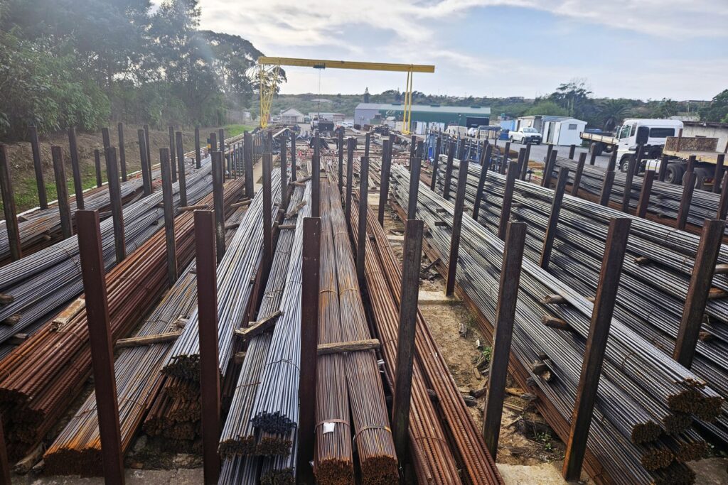 Reinforcing Steel in East London: Your Eastern Cape Supplier 2 Racks of stocked reinforcing steel bars with the gantry crane behind at the RMS East London yard