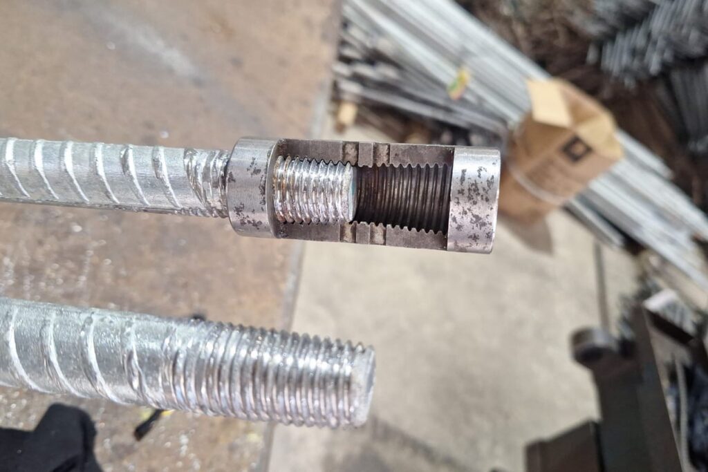 Reinforcing Bar Couplers Compared: Choosing the Right System for Your Project 3 Threaded end of a reinforcing bar with a mechanical coupler fitted, RMS Durban