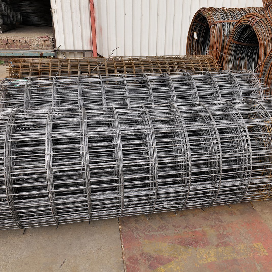 Rolls of welded reinforcing mesh on the yard floor