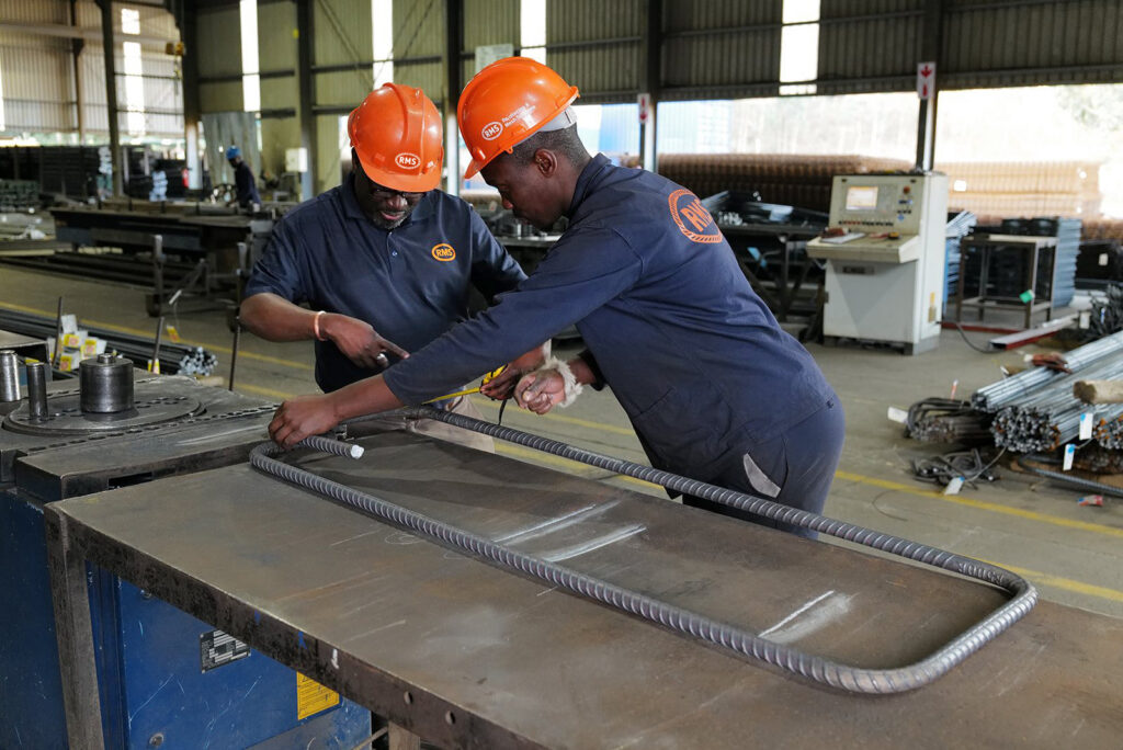 Welded Mesh and Cut and Bend for Coastal Builds in Durban and Richards Bay 10 RMS Durban team checking a bent bar against its shape on the workbench